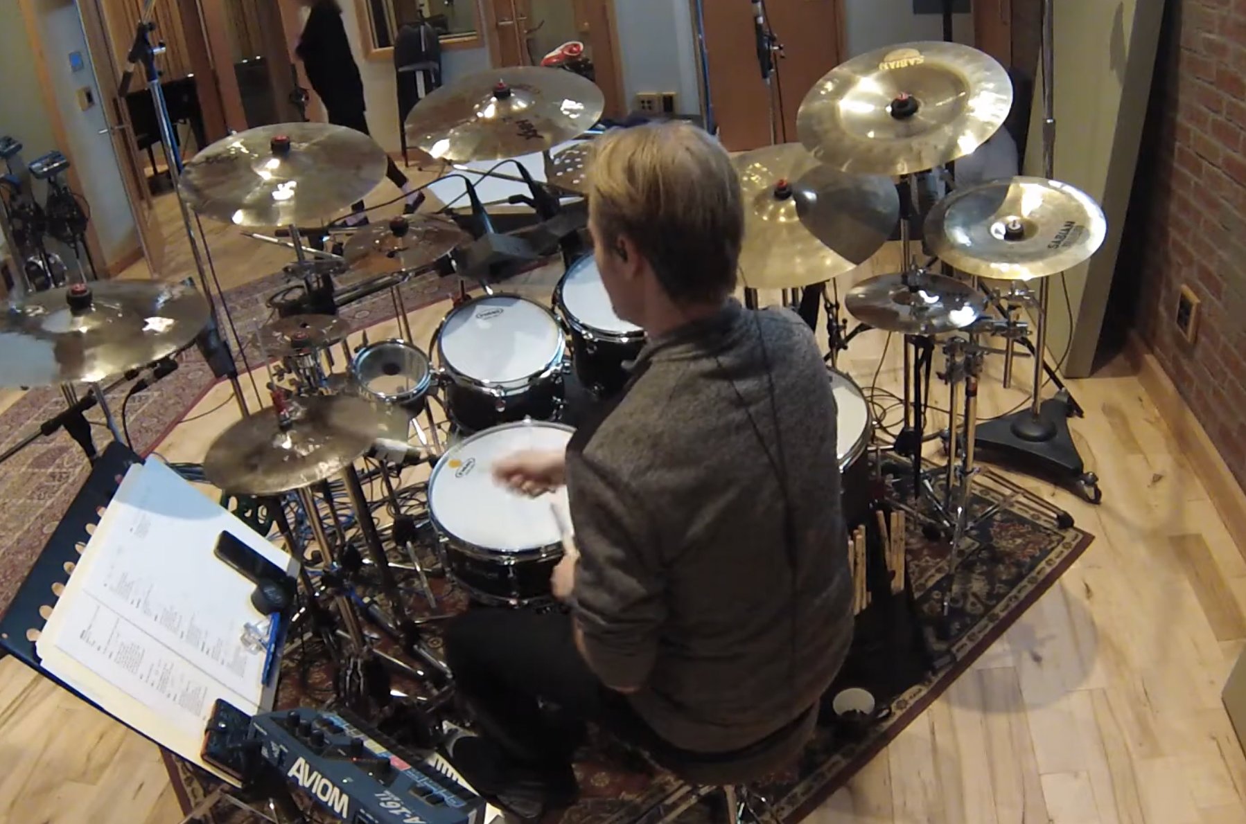 Chris Warunki drumming in the studio